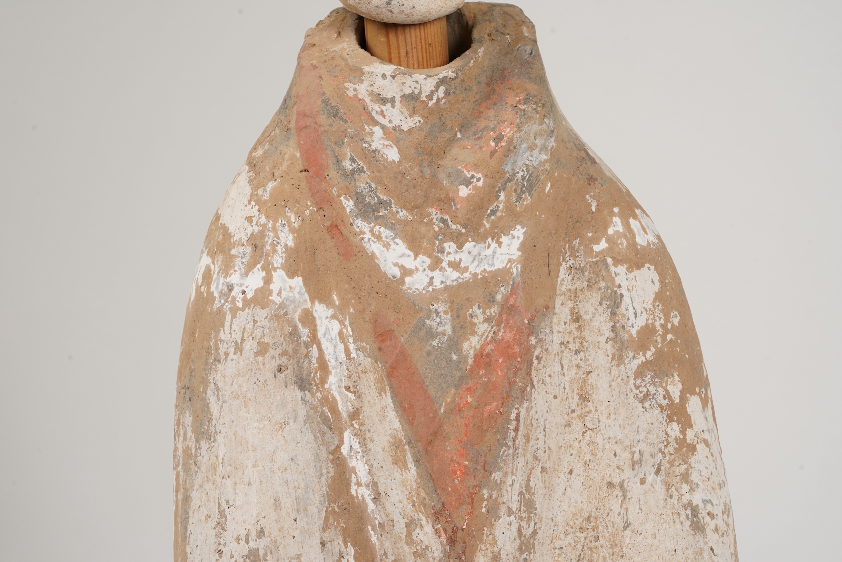 A large Chinese polychrome pottery figure of a female attendant, Han dynasty or later